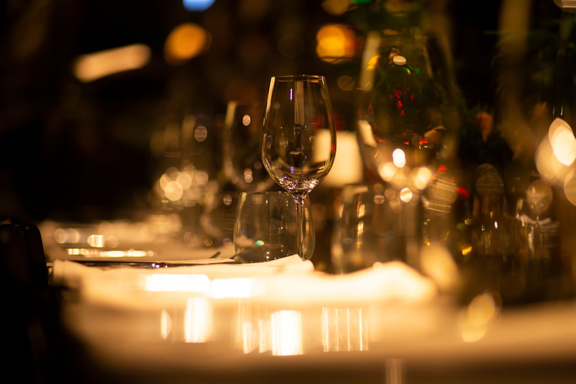 Luxury table settings for fine dining with and glassware, beautiful blurred  background. For events, weddings.