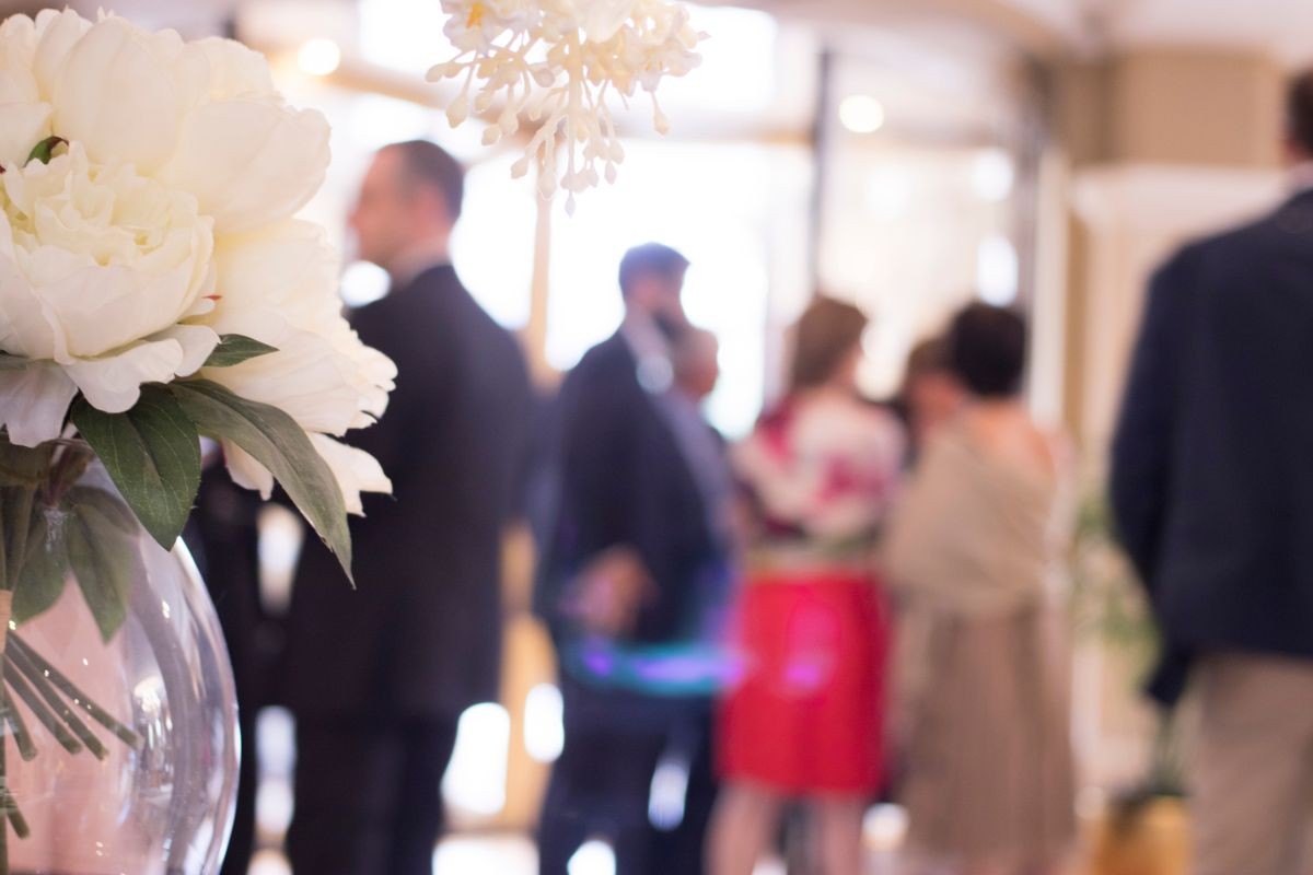 Wedding flowers arranged floral bouquet in marriage luxury 5 star hotel reception room.